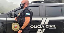 Concurso PC PR: policial ao lado de viatura - Divulgação