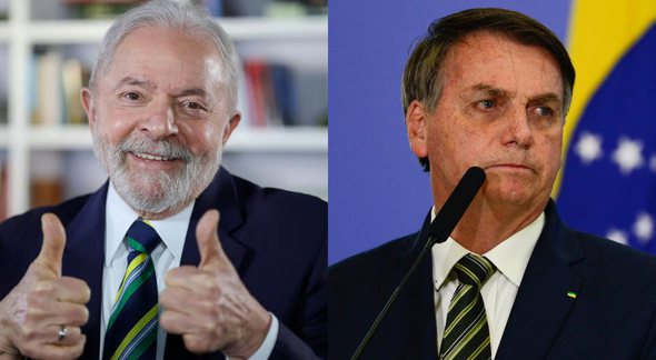 Lula faz sinal de positivo com as mãos e Bolsonaro olha sério para o lado - Divulgação